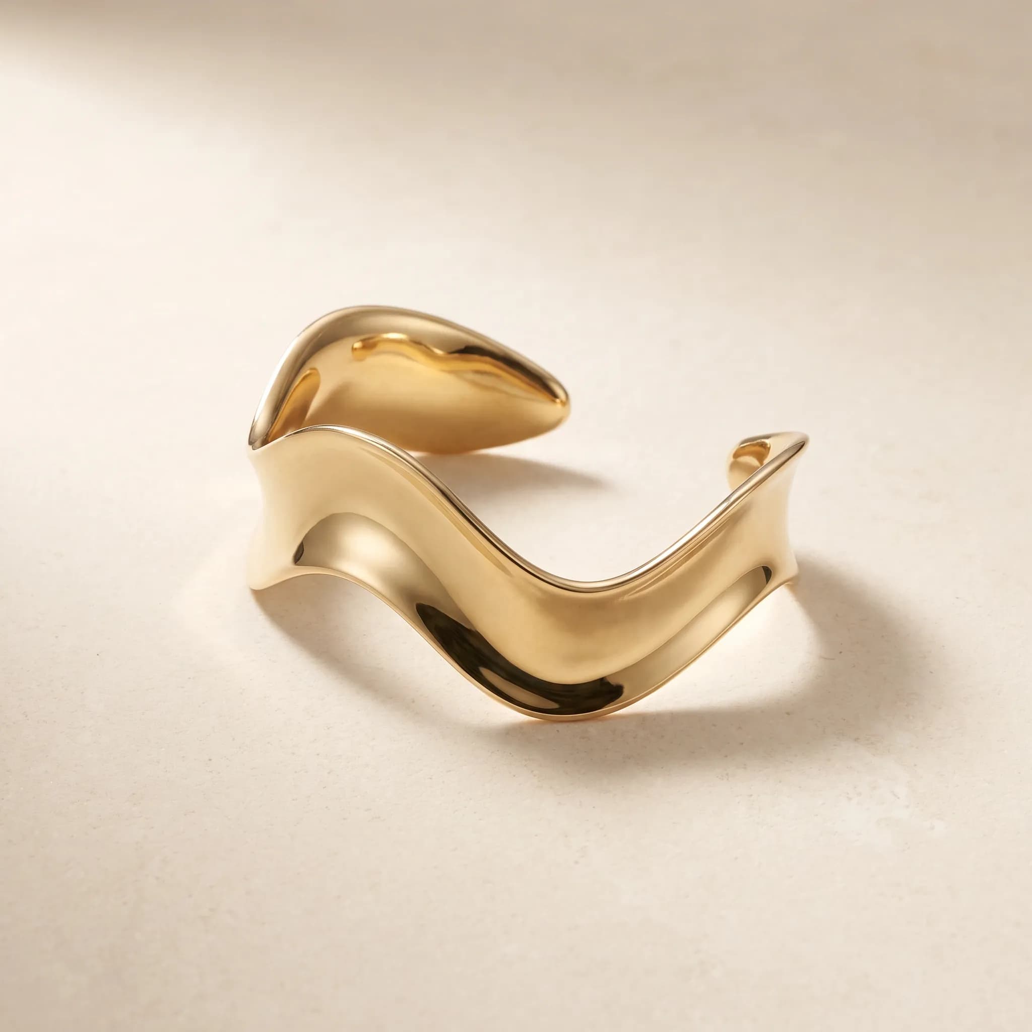 Tidal Cuff, an illustrative yellow-gold tone jewelry concept
