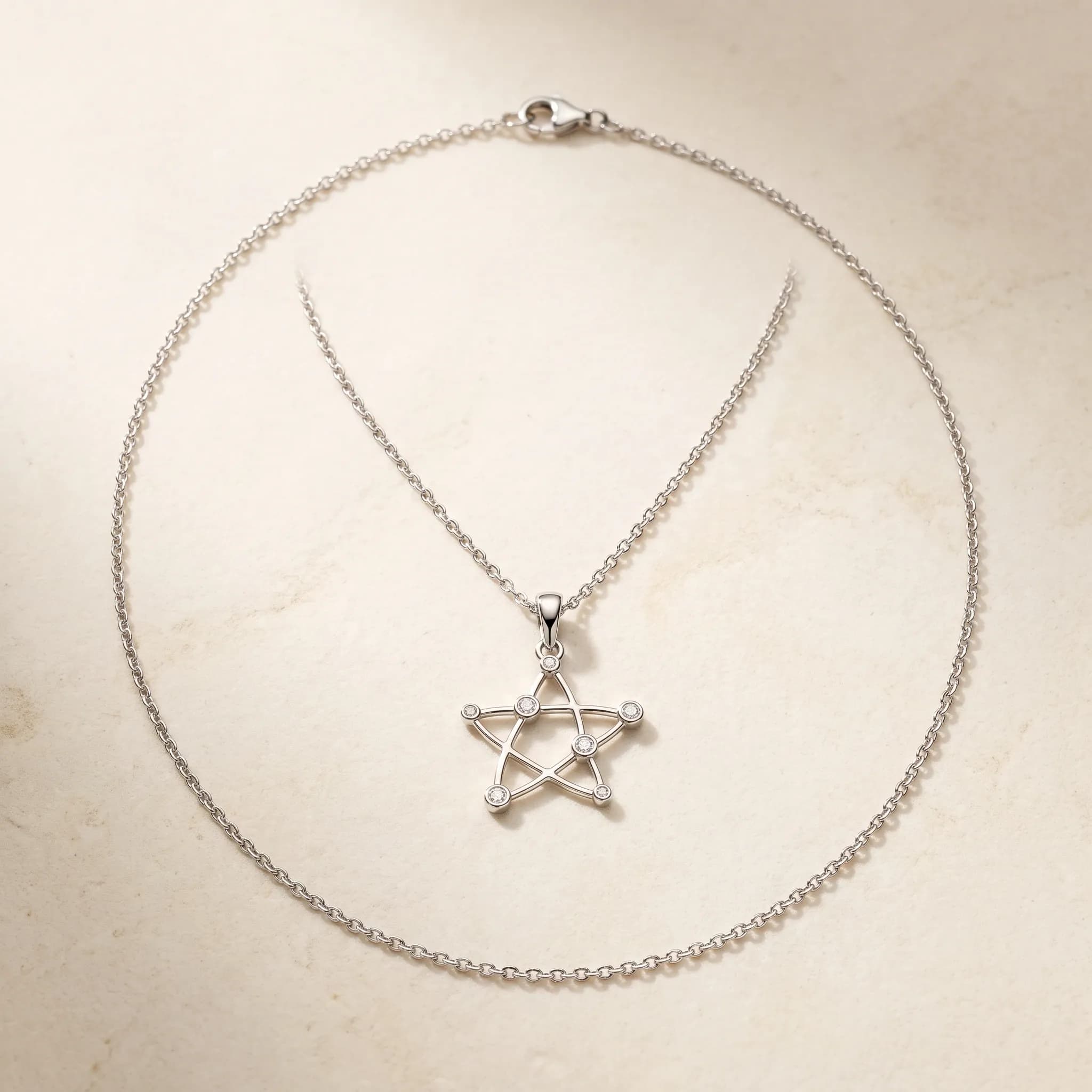 Constellation Pendant, an illustrative white-gold tone jewelry concept